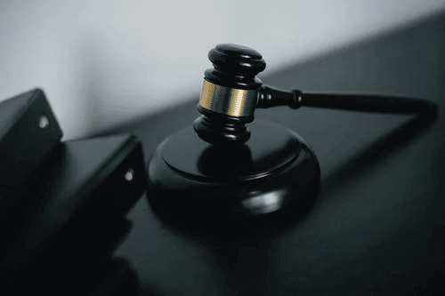 B2B sales rep reviewing compliance checklist on phone: is cold calling illegal guidelines