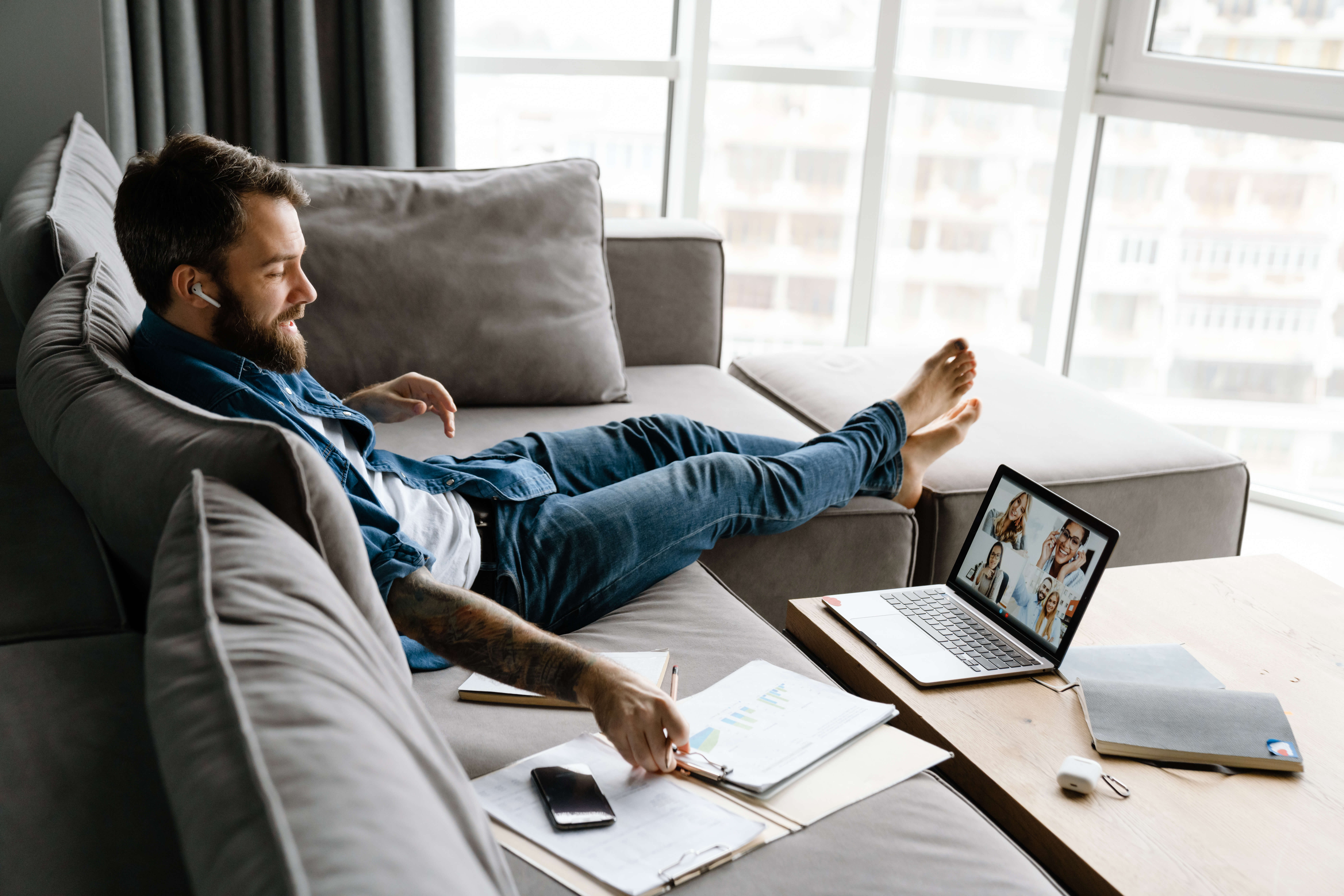 B2B sales rep comparing cold emailing vs cold calling results on laptop dashboard