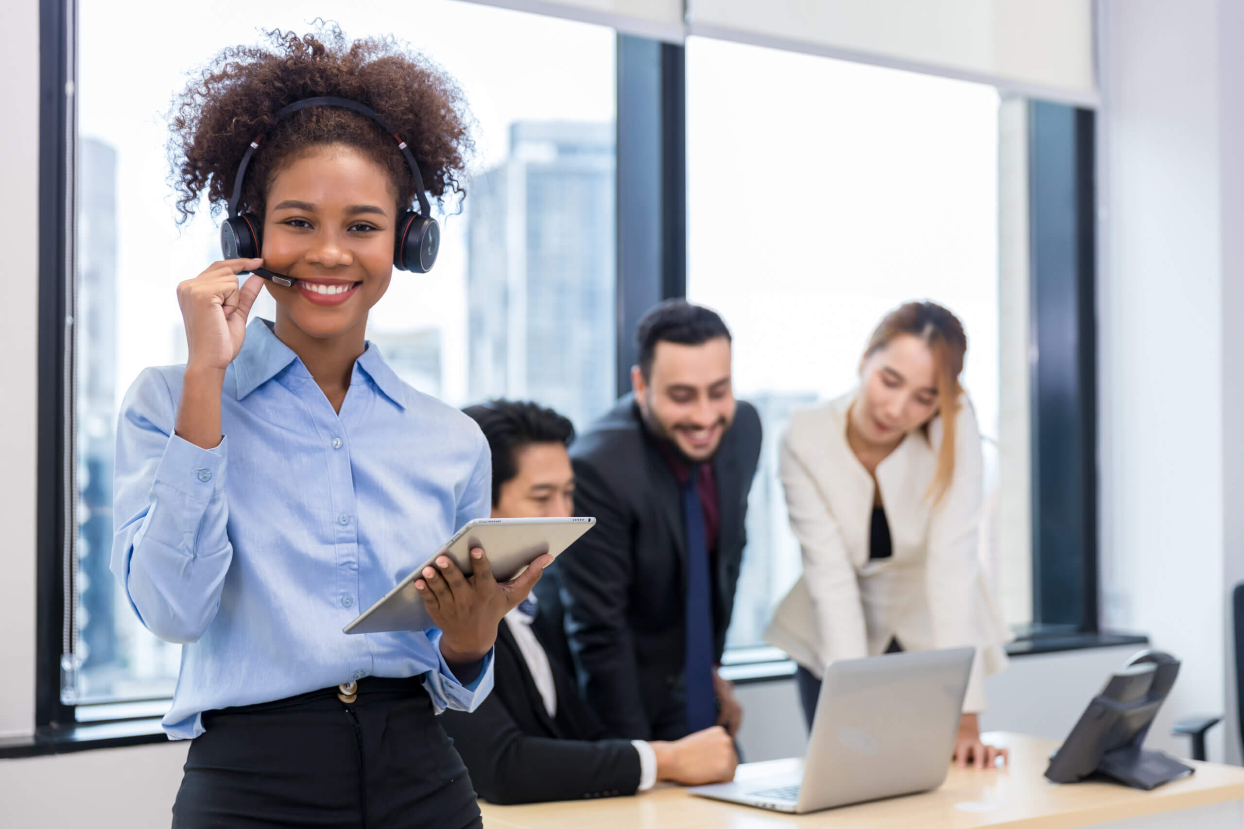 B2B sales rep using headset and CRM dashboard for lead generation cold calling strategy