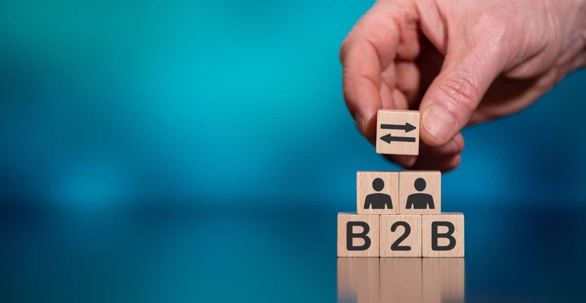 Team planning B2B marketing strategy with multichannel campaign metrics and ICP notes