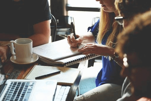 B2B team reviewing outsourcing sales and marketing companies strategy and ROI metrics dashboard