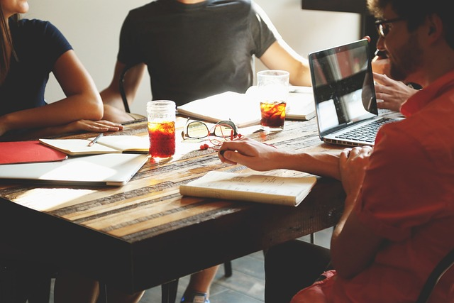 B2B marketing team reviewing outsourcing blogger outreach services performance metrics and vendor report