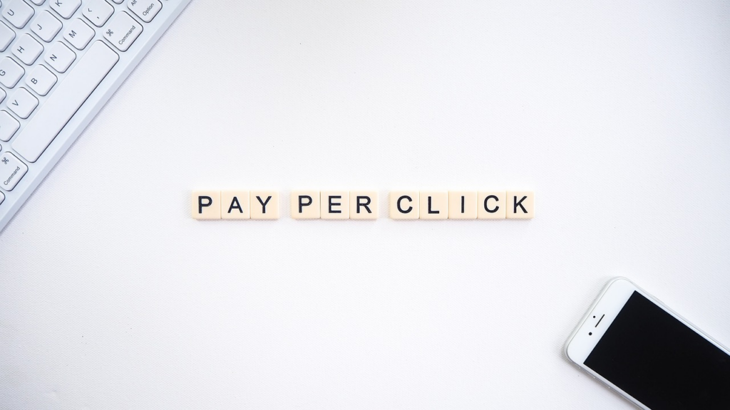 B2B marketer reviewing pipeline dashboard with pay-per-click agency campaign performance metrics